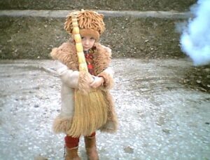 Timid Child with Broom