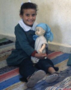 Girl with doll refugee children