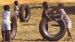 Boys playing with tires